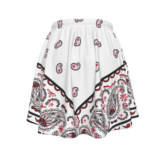 White skirt with red and black paisley pattern on a white background