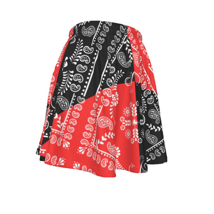 A red and black Paisley motif bandana skirt on a white background.