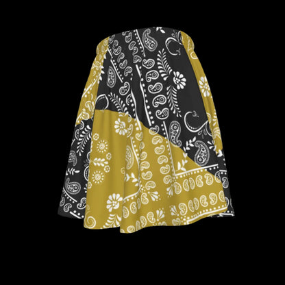 Skirt with black, gold, and white paisley pattern on a white background