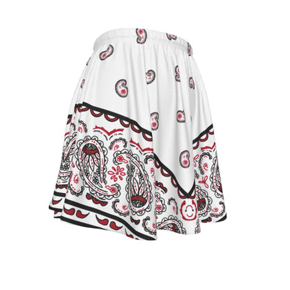 White skirt with red and black paisley pattern on a white background