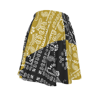 Skirt with black, gold, and white paisley pattern on a white background