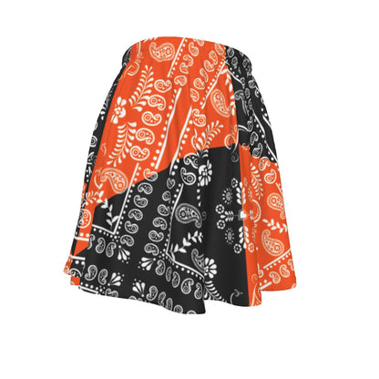 Skirt with orange and black paisley pattern on a white background