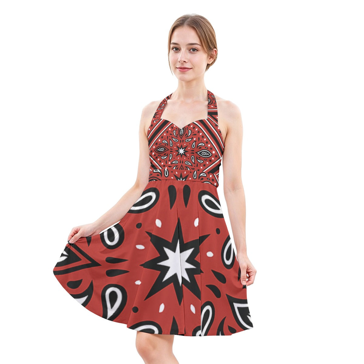 Woman wearing a red dress with black and white pattern on a white background