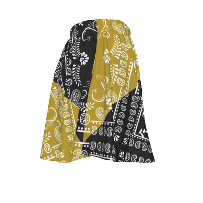 Skirt with black, gold, and white paisley pattern on a white background