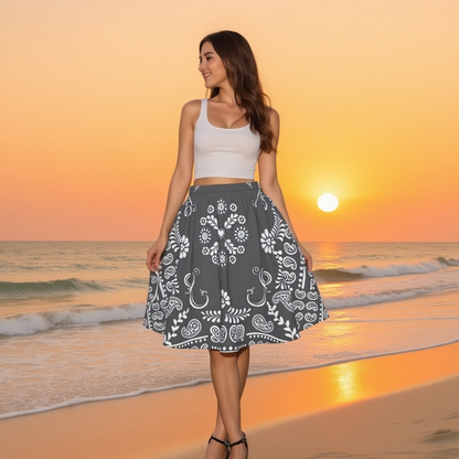 Woman in a Grey and White Bandana SweetHeart skirt standing on a beach at sunset