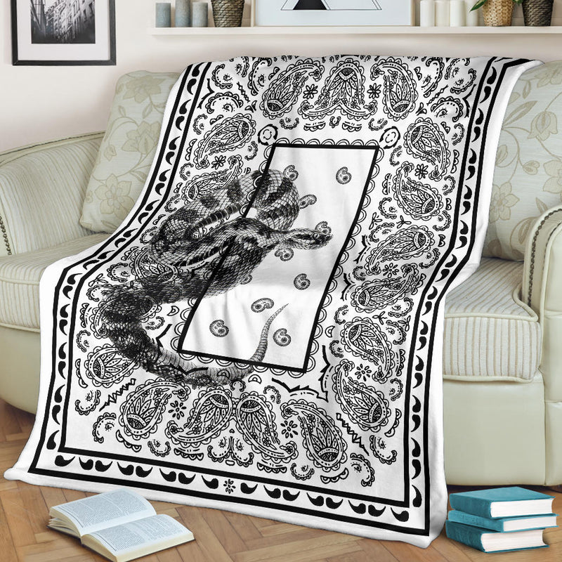 white blanket with reptile art