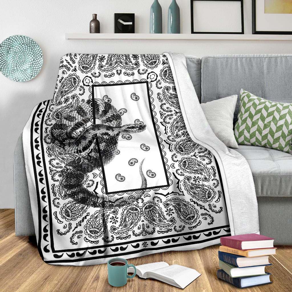 white blanket with snake design