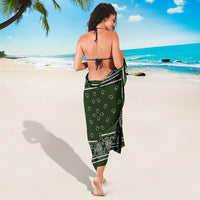 lady wrapped in forest green sarong